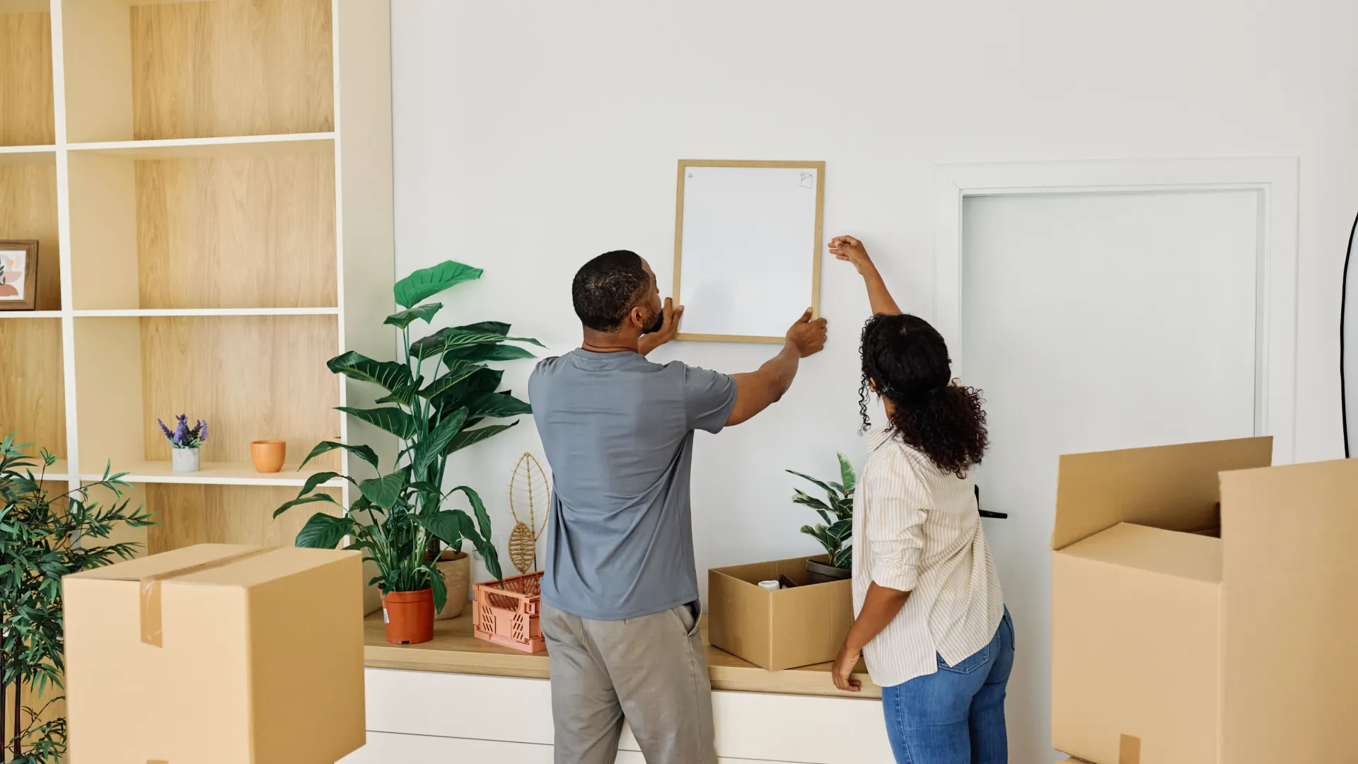 Professional movers loading household furniture for relocation